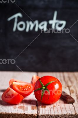 fresh tomatoes and blackboard 