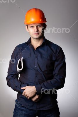 Builder in protective helmet.