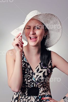 Beautiful smiling girl in a hat