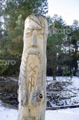 totem wood pole in the blue cloudy background 
