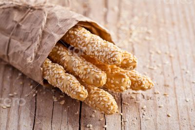 bread sticks grissini with sesame seeds in craft pack 