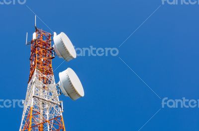 Telecommunication tower on blue sky background