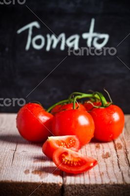 fresh tomatoes and blackboard 