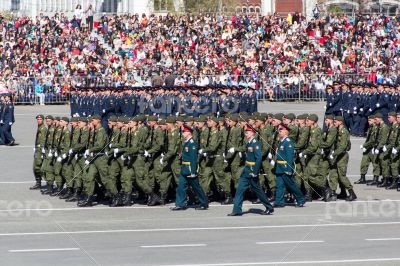 Russian soldiers march at the parade