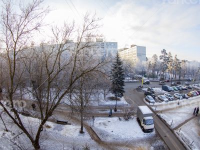A view from the window on the winter city and houses  by fisheye view