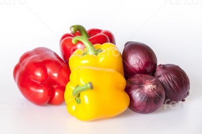 Large red and yellow paprikas and red onions