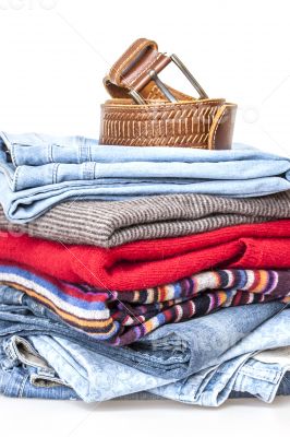 Woolen jumpers of various colors and blue jeans