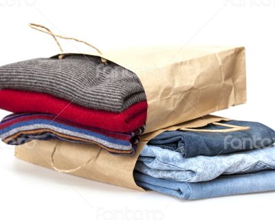 Shopping: jumper and jeans in paper packages