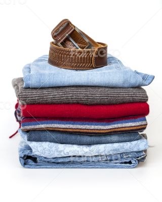 Pile of woolen jumpers of various colors and textures