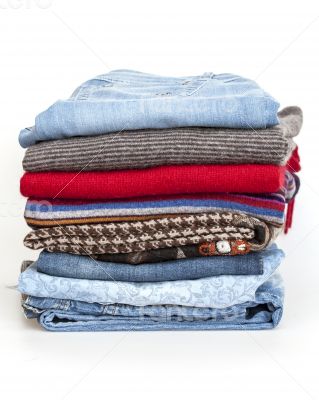 Pile of woolen jumpers of various colors and textures