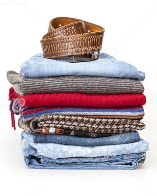 Pile of woolen jumpers of various colors and textures