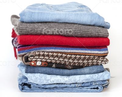 Woolen jumpers of various colors and blue jeans