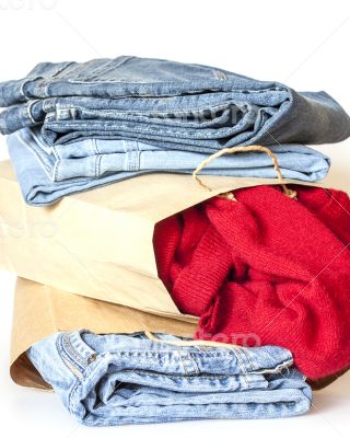 Shopping: jumper and jeans in paper packages