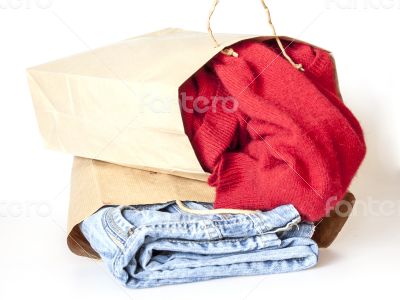 Shopping: jumper and jeans in paper packages