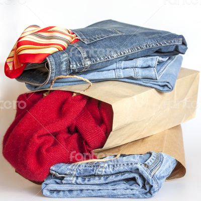 Shopping: jumper and jeans in paper packages