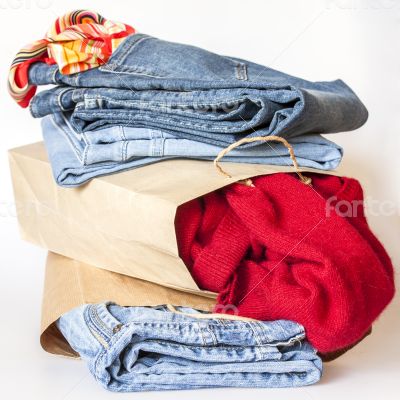 Shopping: jumper and jeans in paper packages