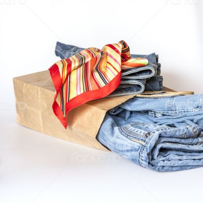 Shopping: jumper and jeans in paper packages