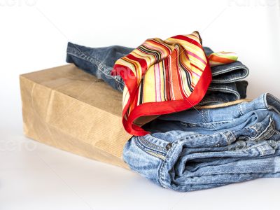 Shopping: jumper and jeans in paper packages