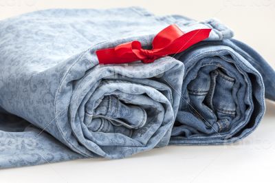 Jeans of indigo color on a show-window of shop