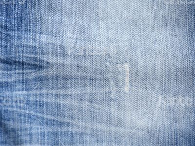Texture of threadbare denim of indigo color