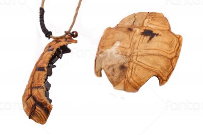 The turtle necklace on the white background