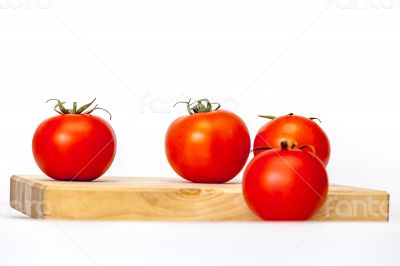 Red juicy tomatoes on the table Red juicy tomatoes on the table