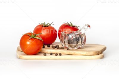 Red juicy tomatoes and black pepper