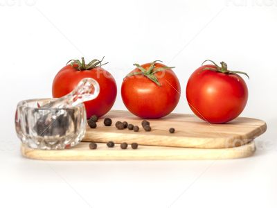 Red juicy tomatoes and black pepper