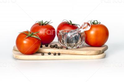 Red juicy tomatoes and black pepper
