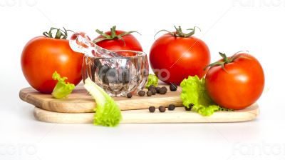  Red juicy tomatoes and lettuce leaves