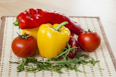 Tomatoes, leaves of arugula and sweet pepper