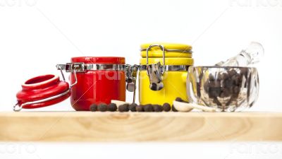 Black pepper and multi-colored containers for spices
