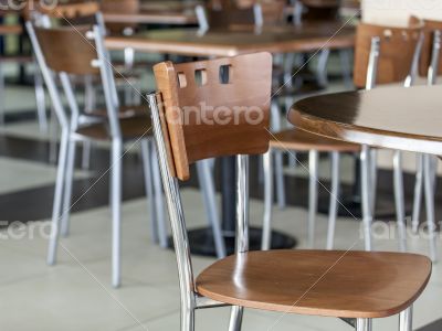 Tables and chairs in cafe in shopping center