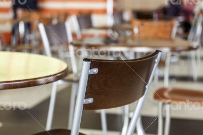 Tables and chairs in cafe in shopping center Tables and chairs in cafe in shopping center