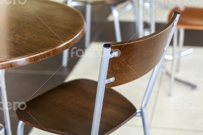 Tables and chairs in cafe in shopping center
