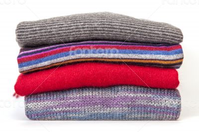 Pile of woolen jumpers of various colors Pile of woolen jumpers of various colors