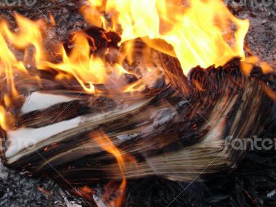 Flame of burning paper sheet stack