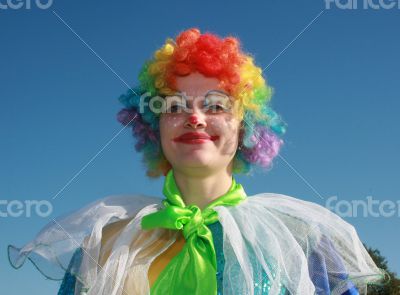 Two bizarre clowns in colored wigs