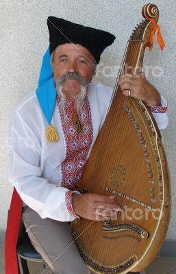 Senior ukrainian musician kobzar with bandura