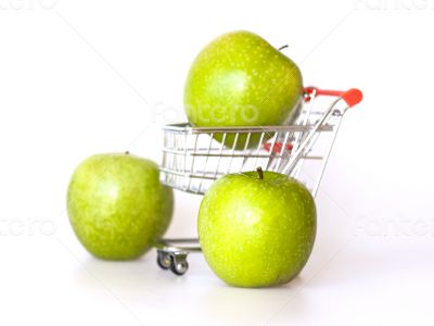 Large green apples in the cart for shopping