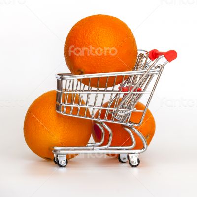 Large bright oranges in the cart for shopping