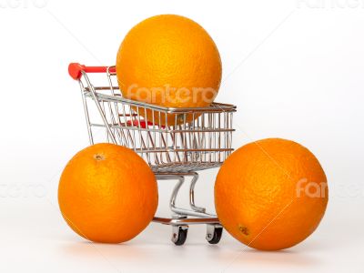 Large bright oranges in the cart for shopping