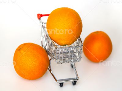 Large bright oranges in the cart for shopping