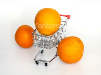 Large bright oranges in the cart for shopping