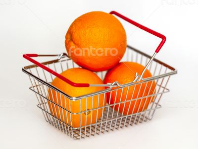 Bright large oranges in a basket for shopping