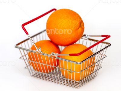 Bright large oranges in a basket for shopping