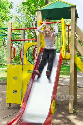 Active girl on nursery platform in summer