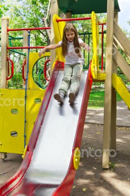 Active girl on nursery platform in summer