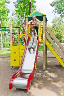 Two active girls on nursery platform