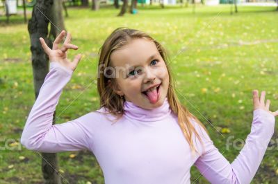 Cute girl with put out tongue